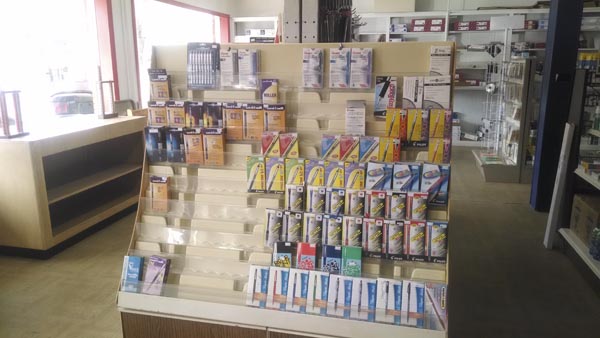 A shelf full of pens